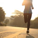 young fitness woman runner athlete running at road